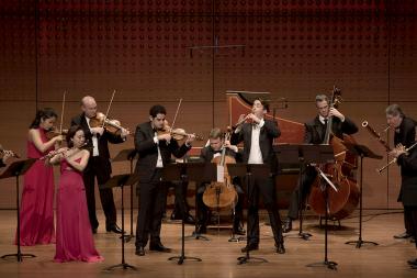 Chamber Music Society performs on stage with their instruments.