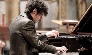 Pianist Federico Colli at the piano who will be performing November 16 with San Francisco Performances.