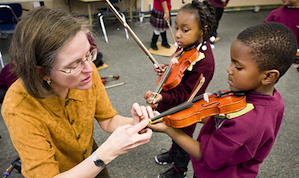 Stephanie Railsback instructs kindergartners at St. Martin de Porres School Photo by Chris Duffey