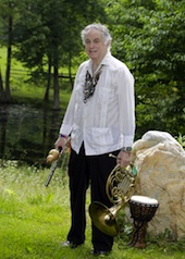 Multi-instrumentalist Amram poses on his farm with French horn, Irish pennywhistle, Chinese husai, and Arabic dumbek. His guayabera shirt is a gift from Latin jazz master Paquito d'Rivera. 