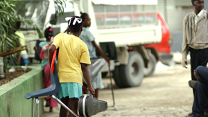 Without the school, children move furniture and instruments in the makeshift environment.