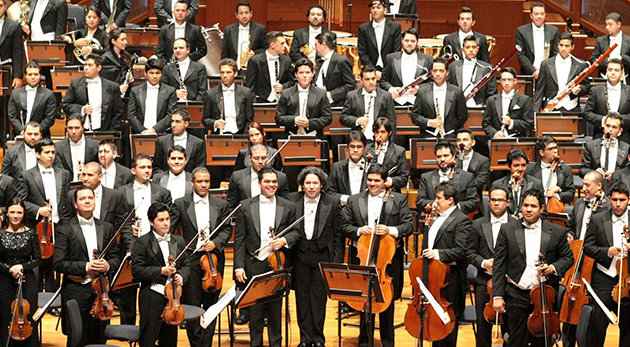 The Simón Bolívar Symphony Orchestra of Venezuela, with concertmaster Alejandro Carreno and conductor Gustavo Dudamel at center front.