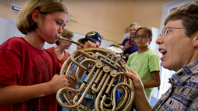 Children exploring the Instrument Petting Zoo at Crowden Community Music Day.