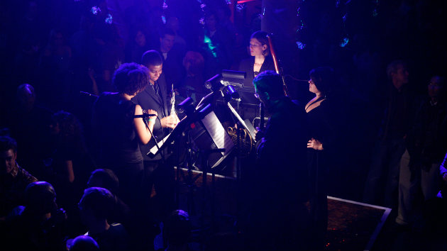 Musicians performing in the center of the crowd at Mercury Soul in San Francisco.