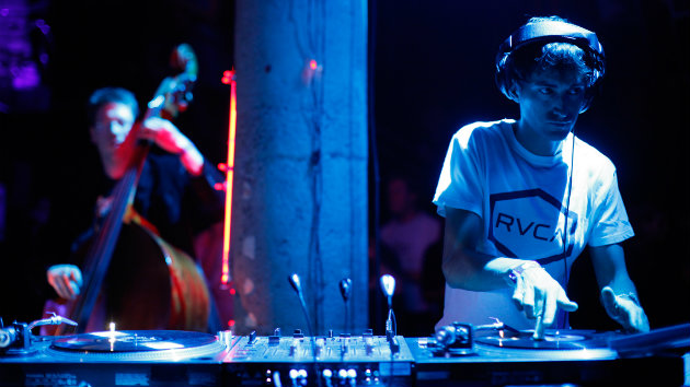 Mason Bates DJing while accompanied by musicians at Mercury Soul in San Francisco.